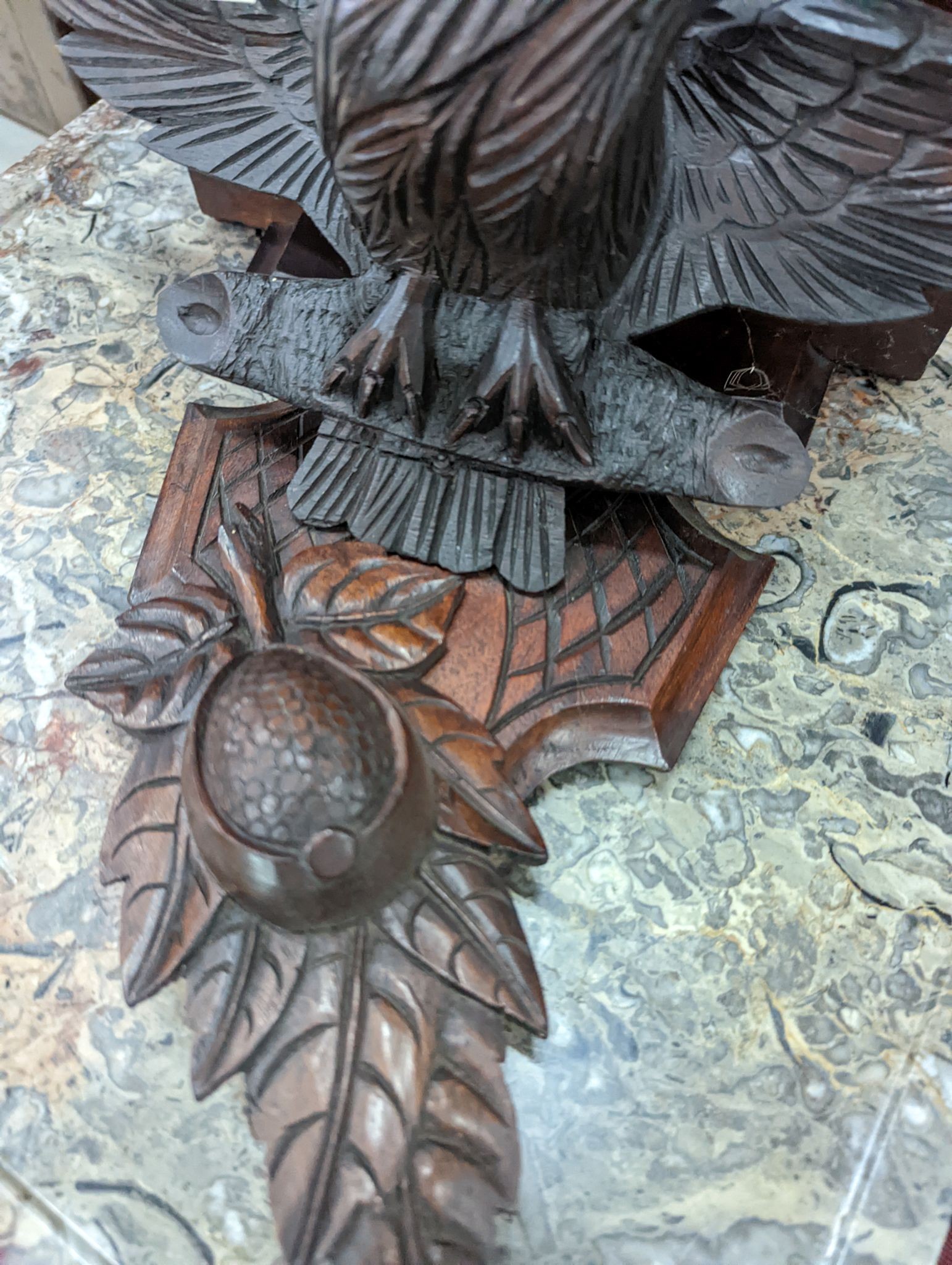 A Black Forest carved eagle wall bracket, width 34cm, height 30cm